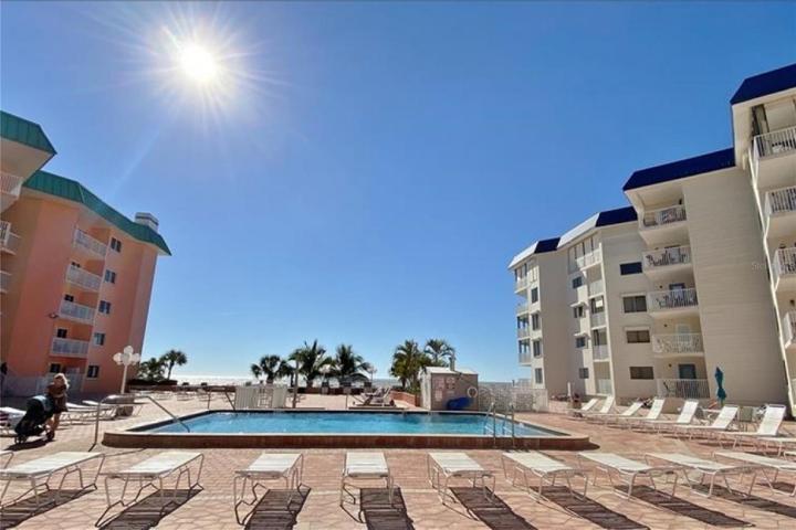 Pool deck offers beautiful view of the beach and Gulf.