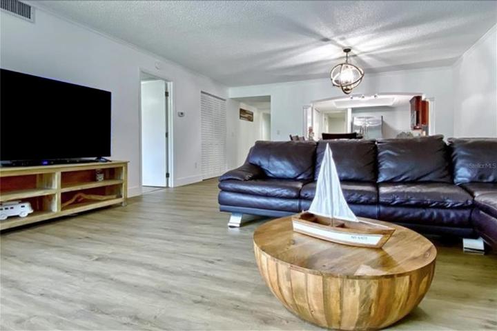 Living room with Primary Bedroom entry