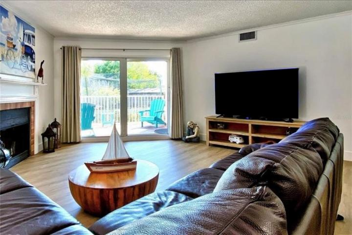 Main living room with sliders to covered deck