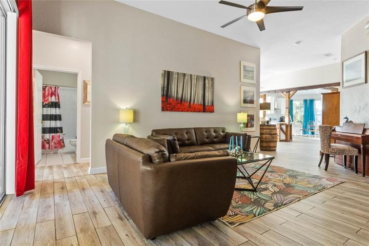 Stunning wood-like tile floors seamlessly flow throughout the entire home.