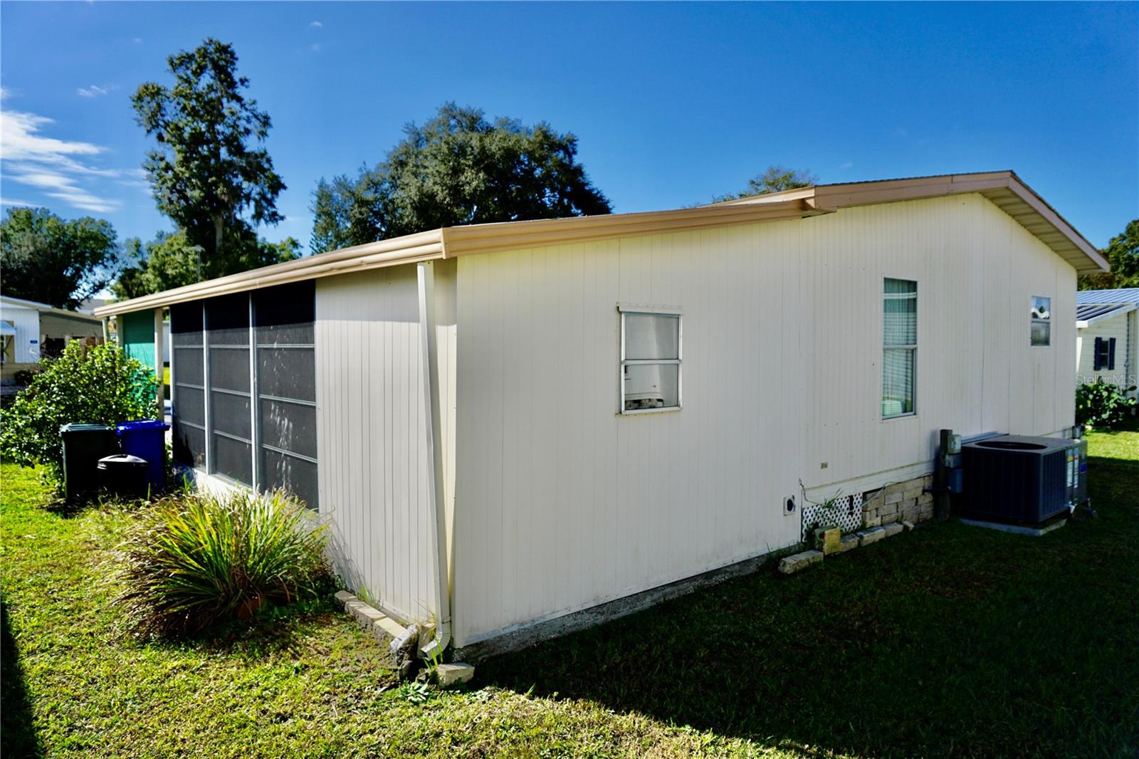 Back Corner of Carport/ Exterior Bonus Room/ Laundry Room