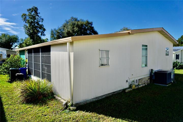 Back Corner of Carport/ Exterior Bonus Room/ Laundry Room