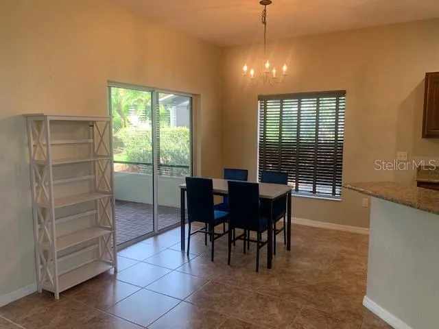 eating area next to patio area and kitchen