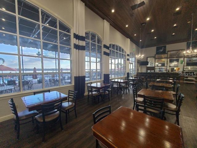 Restaurant overlooking pool and lake.