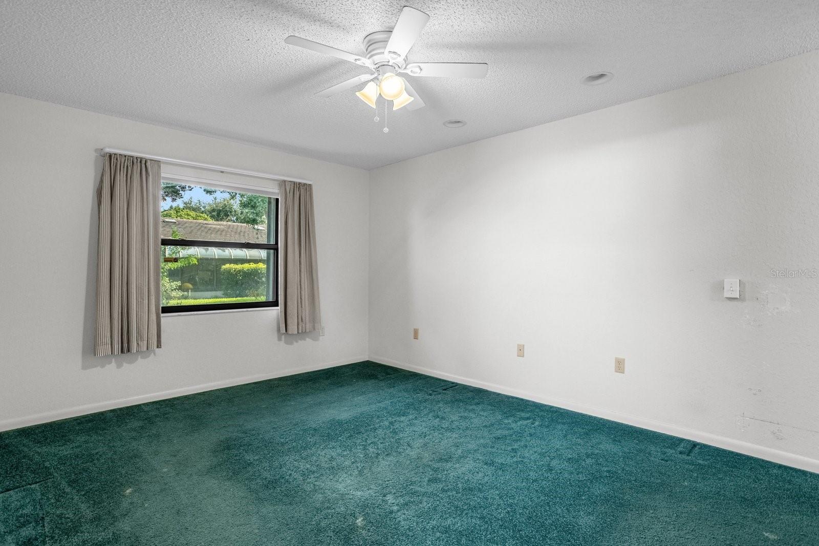Master Bedroom with Window and Ceiling Fan
