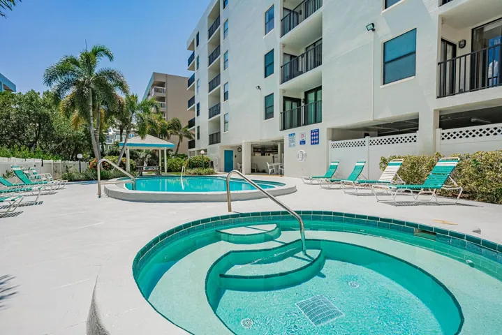 Pool area with spa and seating