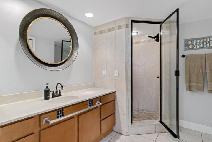Master bathroom with vanity and shower