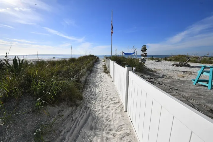 Walk over to the sugar sand beach