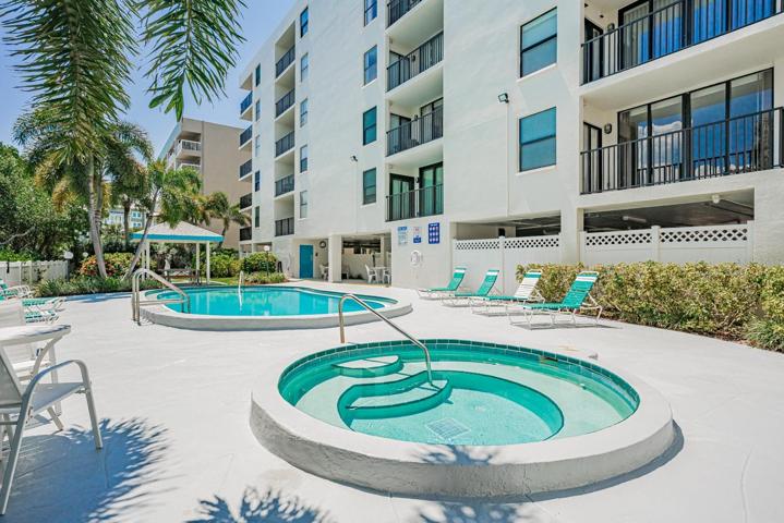 Pool area with spa and seating