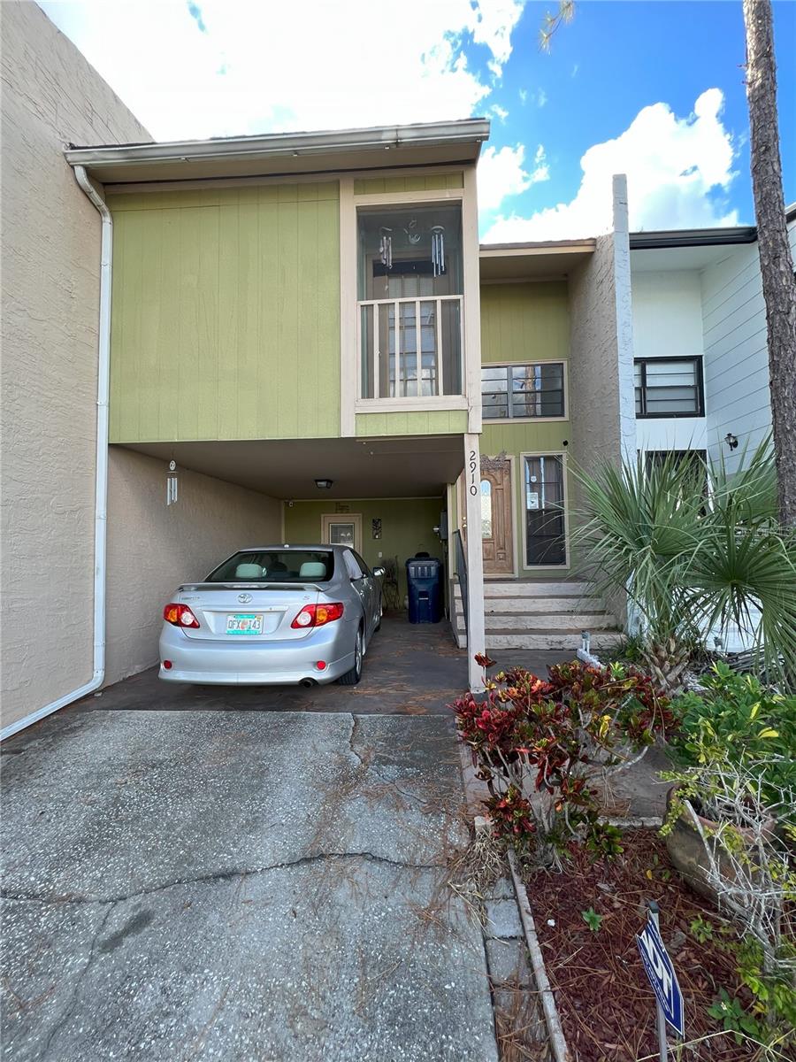 Entry of townhome and upstairs balcony
