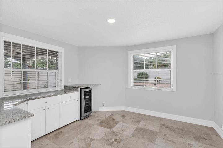 Additional room off of the kitchen.  Perfect for a table, plus lots of storage and counter space