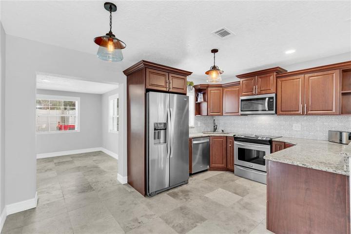 Open kitchen with granite countertops