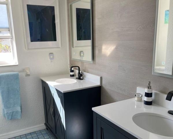 2nd bath with double sinks and jacuzzi tub shower