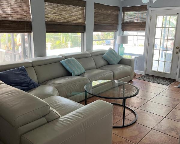 Back den off the enclosed pool area and patio