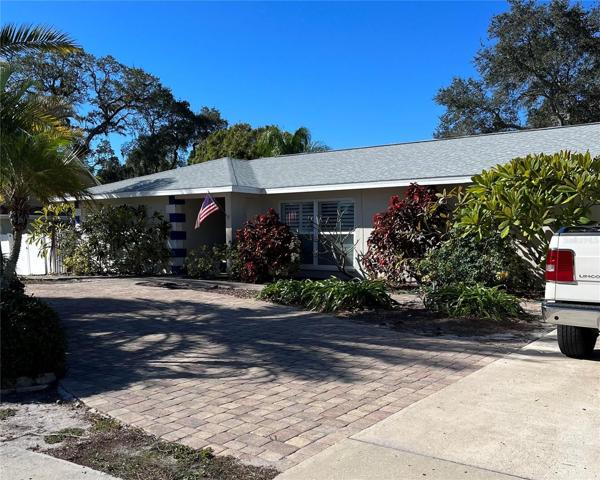 Large paver circular driveway and double parking pad