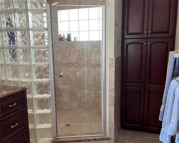 walk in large shower for main bedroom bath and built in cabinets