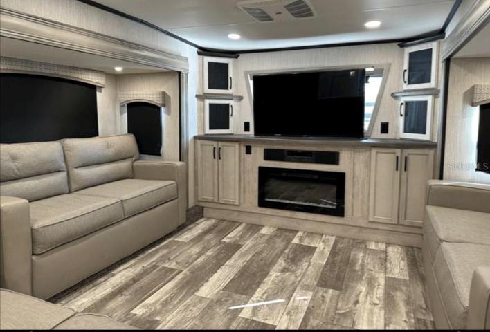 Spacious living room of the 5th wheel the owners of the lot have for sale.