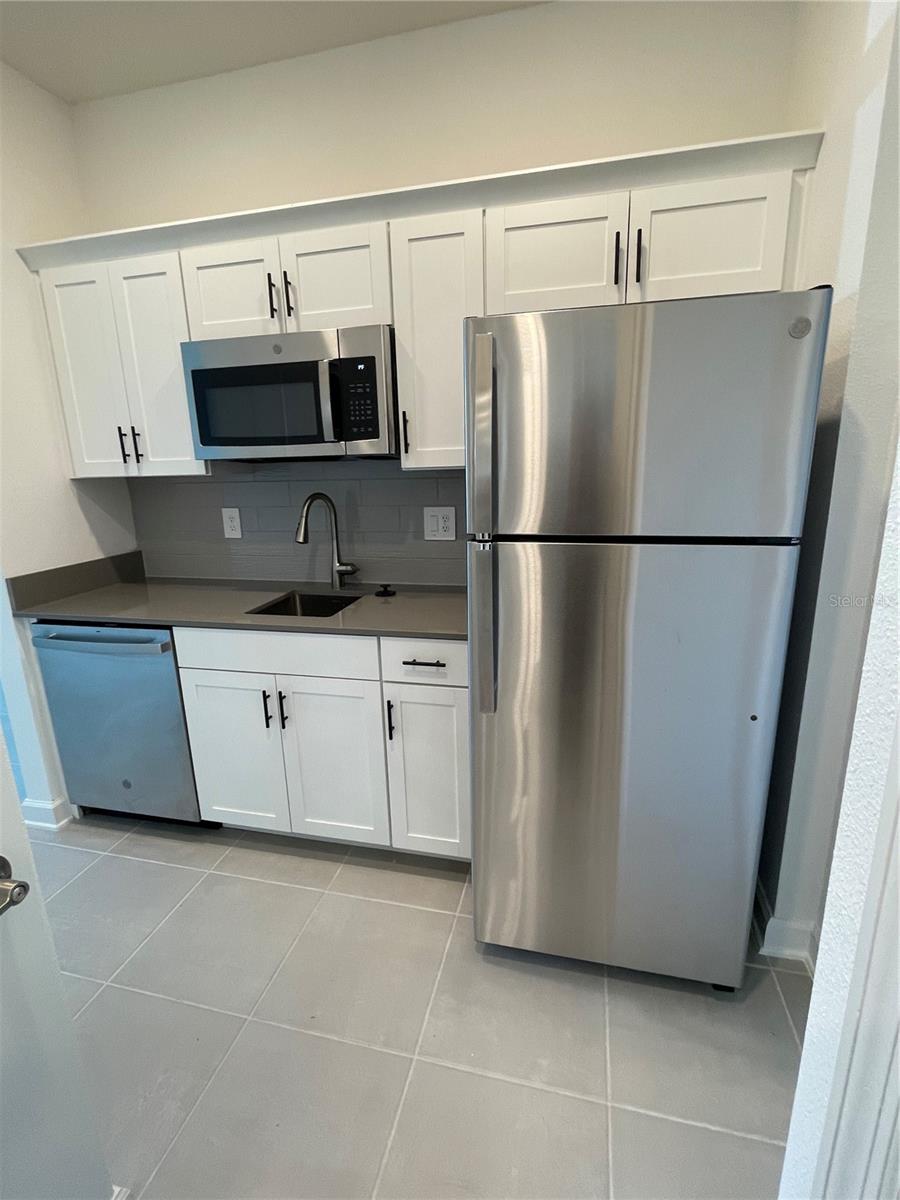 Kitchenette (Dishwasher, microwave, refrigerator, washer and dryer)