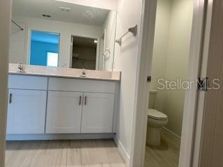 Primary bath with water closet for privacy.