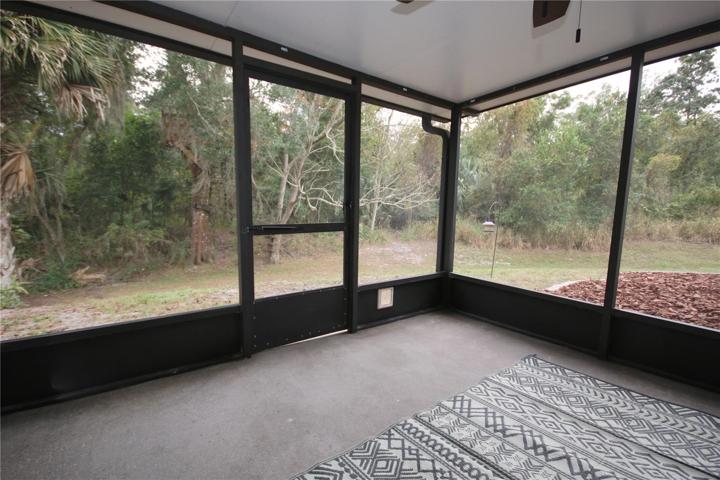 Screened in back porch overlooking the quiet nature preserve