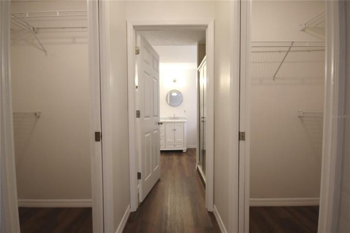 Master bedroom with his and hers closets.