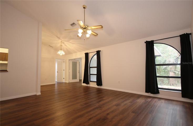 Front entrance into the living room with vaulted ceilings