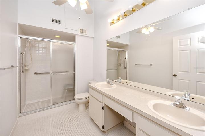 master bath with vaulted ceilings