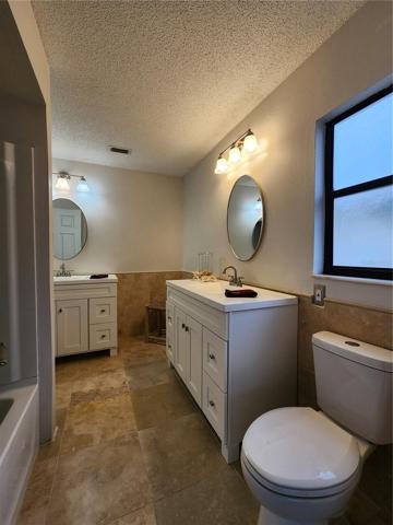 Primary Bathroom features new tub/shower surround, new toilet and new double vanities!