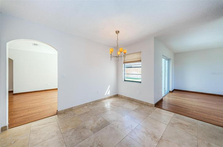 Breakfast nook is center, arch to left is living/dining room and room to right is optional family room, formal dining room or 3rd bedroom