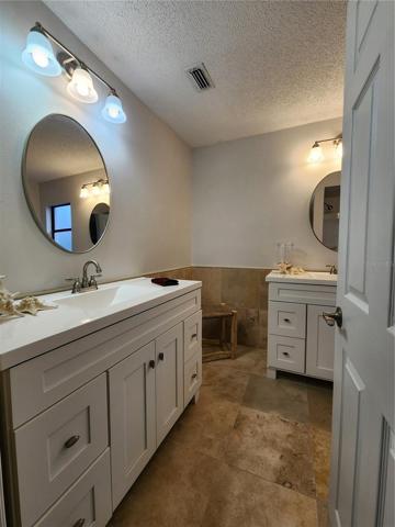 Second view of Primary bathroom from hall entry