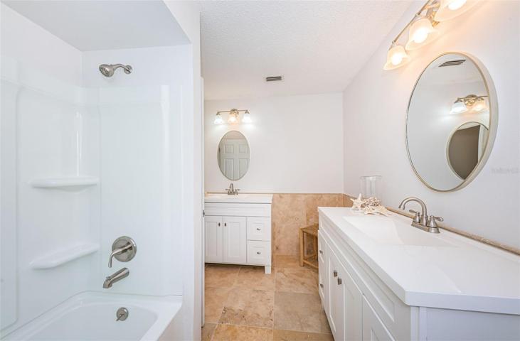 Primary Bathroom, new tub-shower, sinks,vanities, and lighting mirrors in 2024
