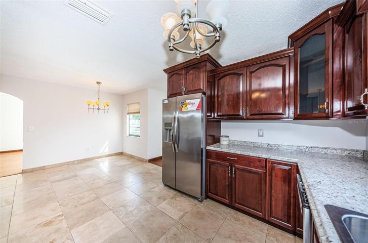 kitchen, breakfast nook, door to right is to optional family room, formal dining room, or possible 3rd bedroom (no closet)