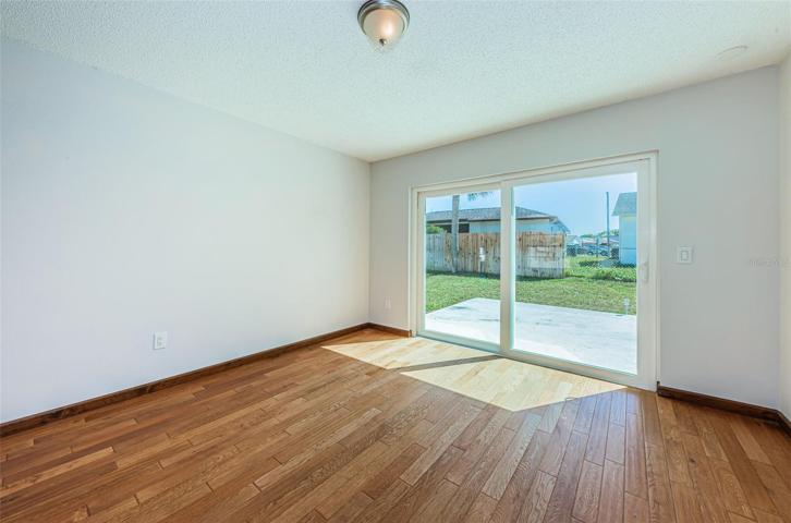 Living room, view to backyard, new sliding doors 2023