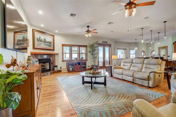Living room with fire place and view of the lake