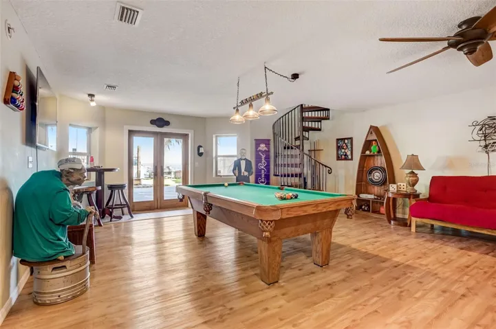Basement gaming/living area with lake view