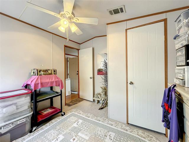 The guest bedroom has a spacious closet