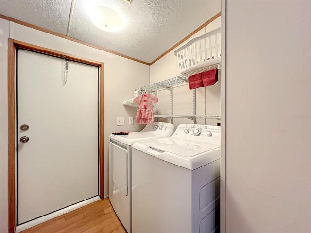 Inside laundry room, washer and dryer are only 3 years old
