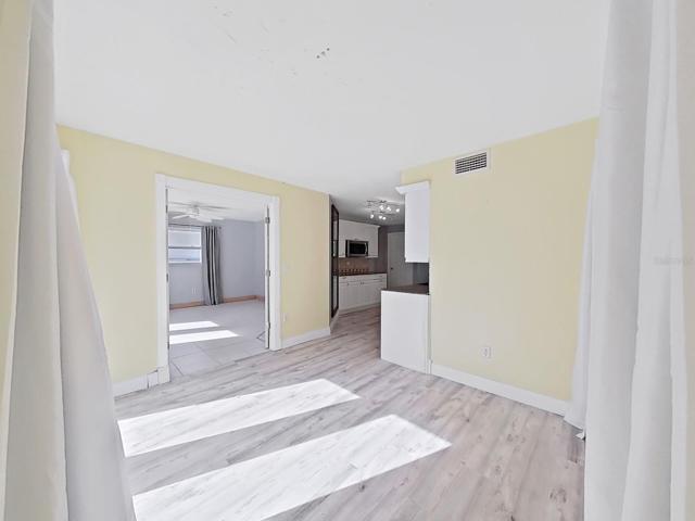 From dining area to kitchen and Primary Bedroom