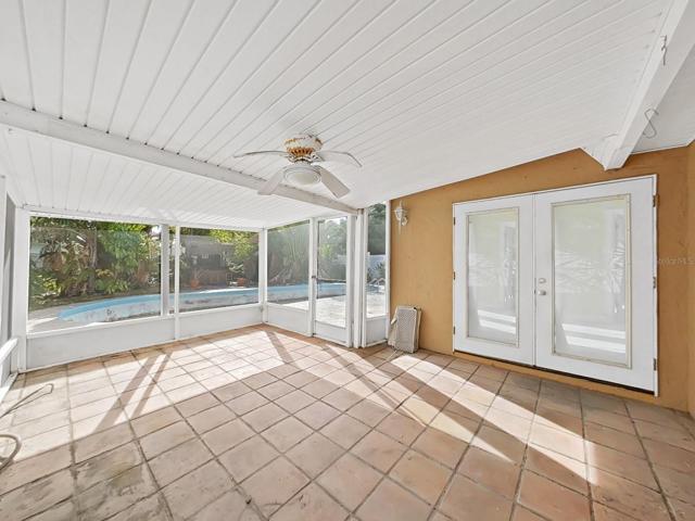 Screened patio off of the dining area and ppol