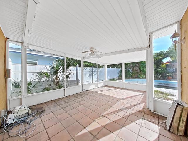 Screened patio off of the dining area and ppol