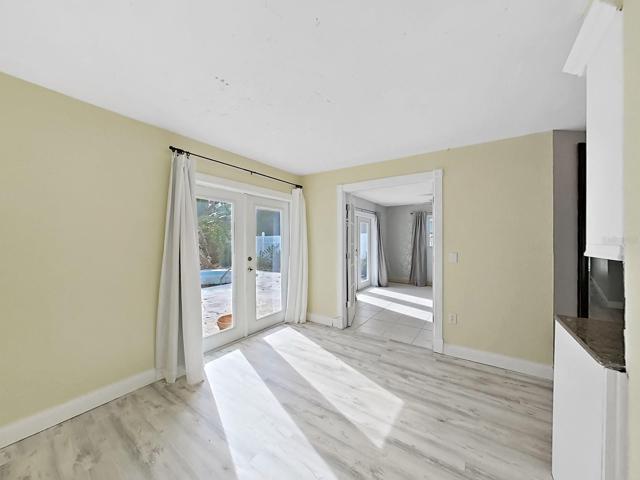 Dining area off the kitchen leading to the pool area and screened patio