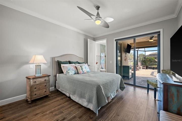 Guest Bedroom with patio sliding door to the pool area