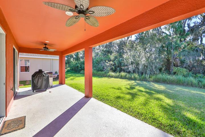 Under roof with fans offering premium outdoor living space