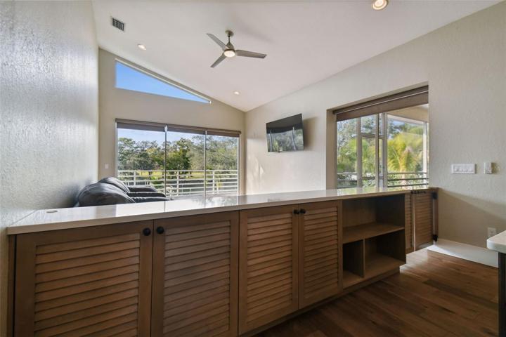 Custom built serving style half wall with stone top.