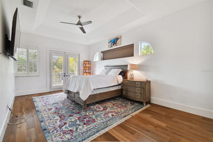 Owners suite w/ french doors to balcony.