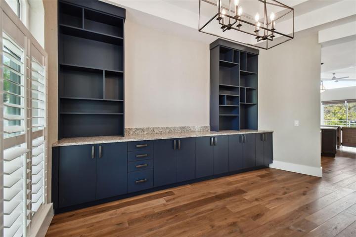 Custom serving side wall with built in cabinetry.