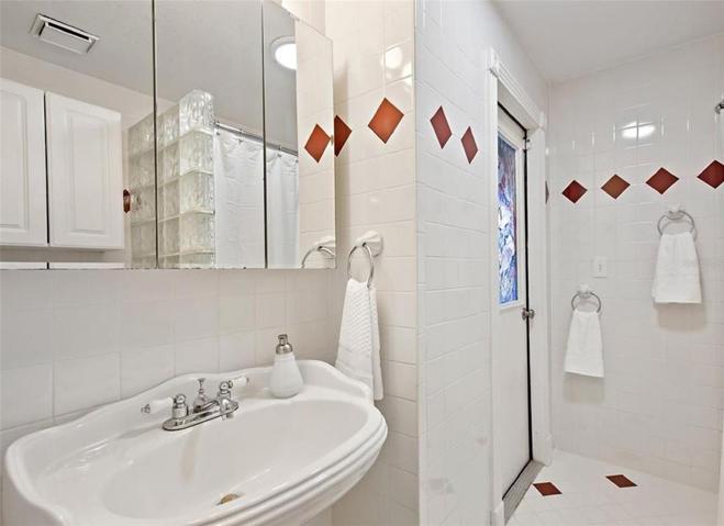 Downstairs bath with door to pool.