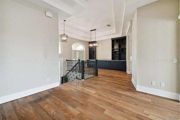 Upstairs landing formal living room, dining room, and kitchen entrances