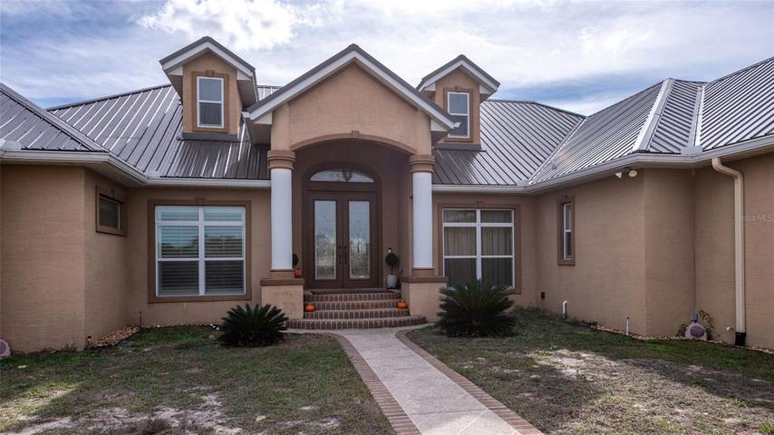 Welcoming Double Door Portico Entrance