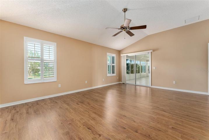 PRIMARY BEDROOM view showing VAULTED CEILINGS